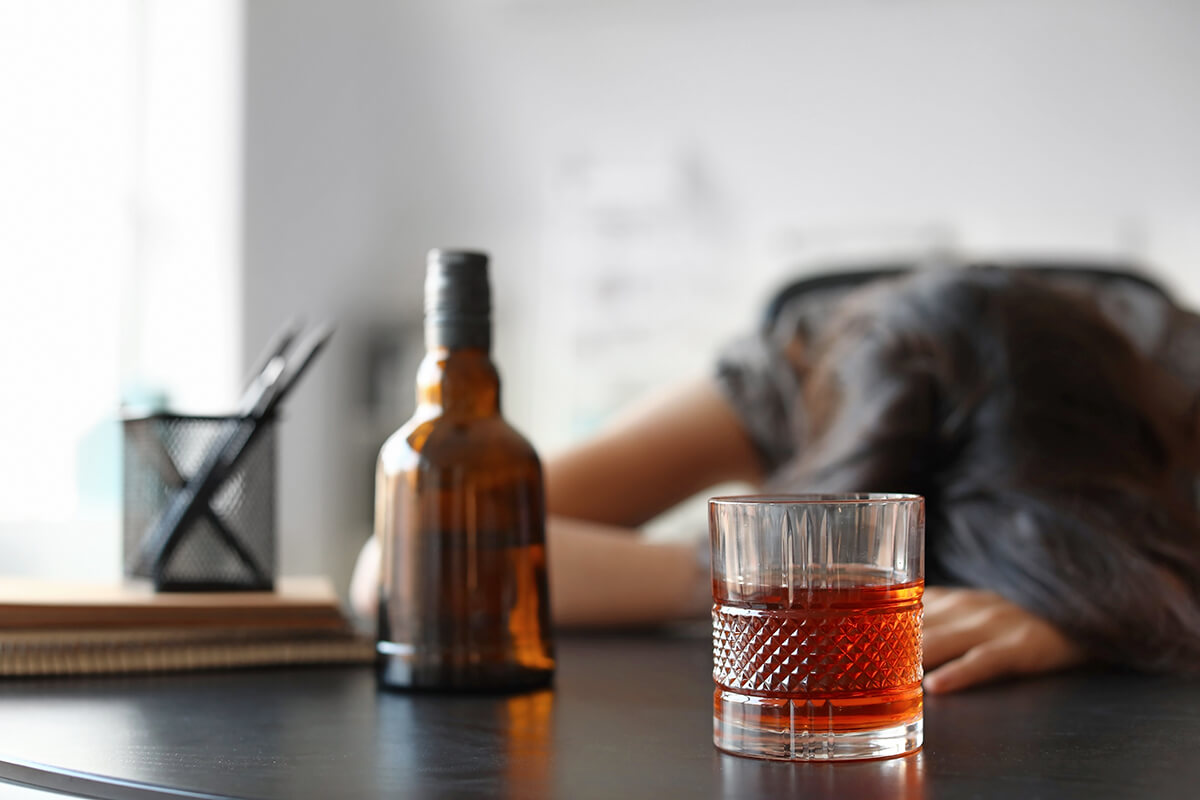 woman passed out showing signs of alcoholism