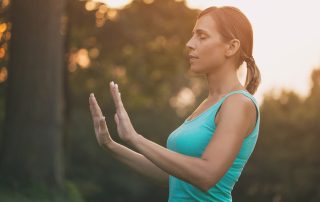 woman outside meditating learning how to practice patience