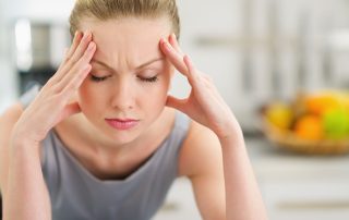 a woman feeling stressed from a behavioral addiction