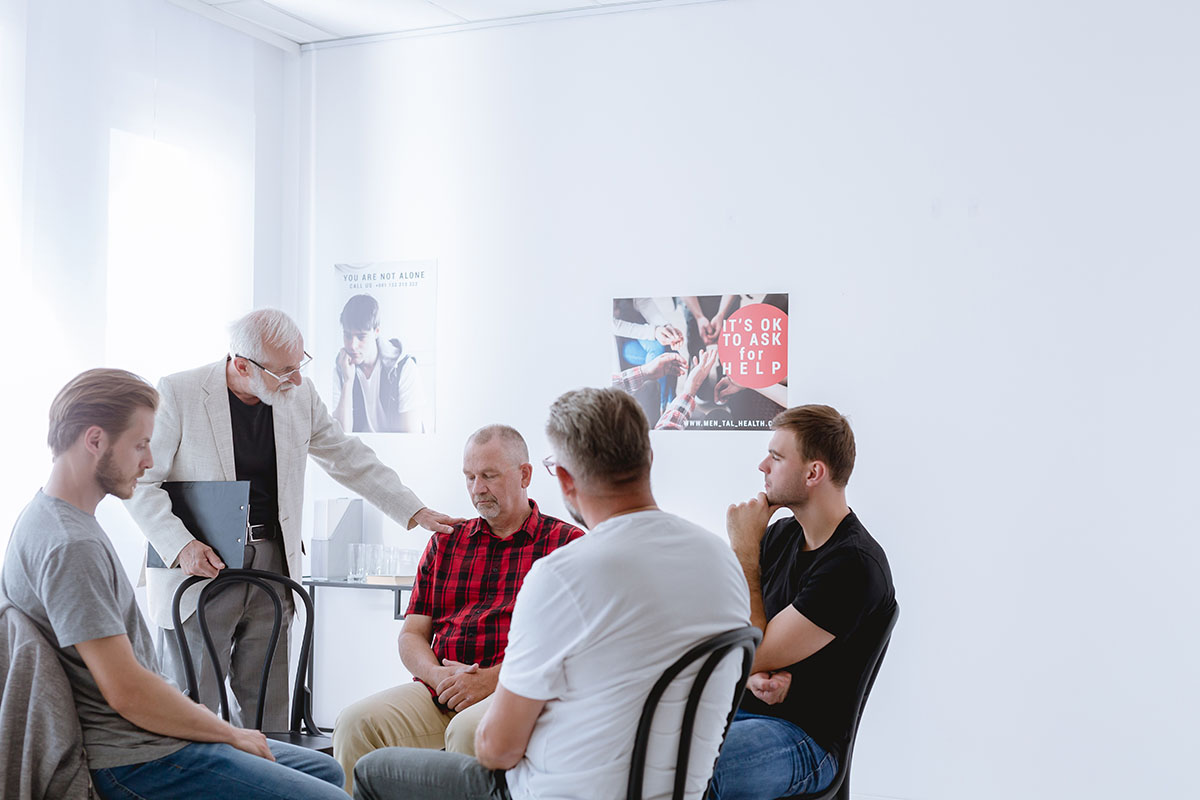men talking at a gender-specific rehab