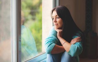 woman thinking about relapse prevention in quarantine