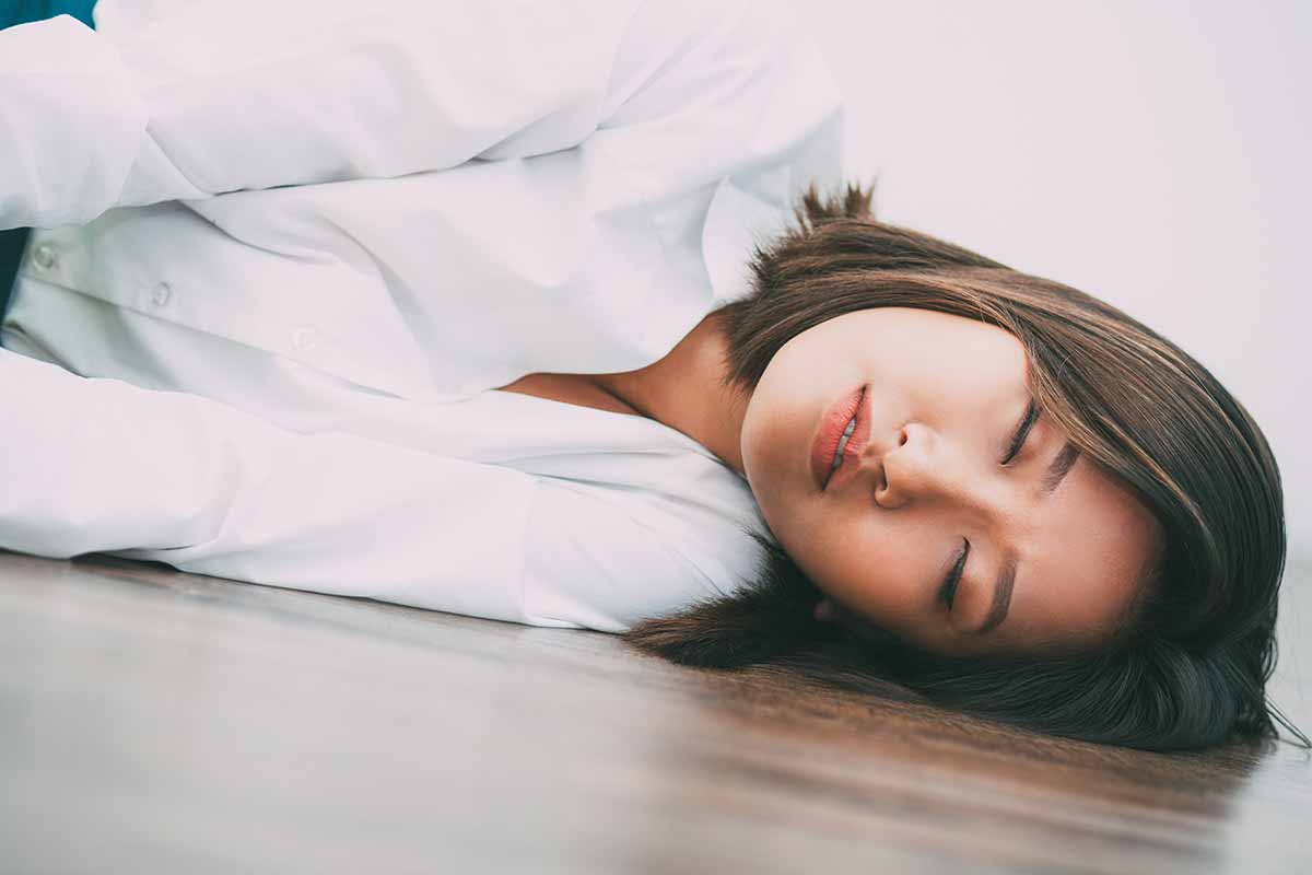 woman sleeping on the floor showing dangers of fentanyl withdrawal