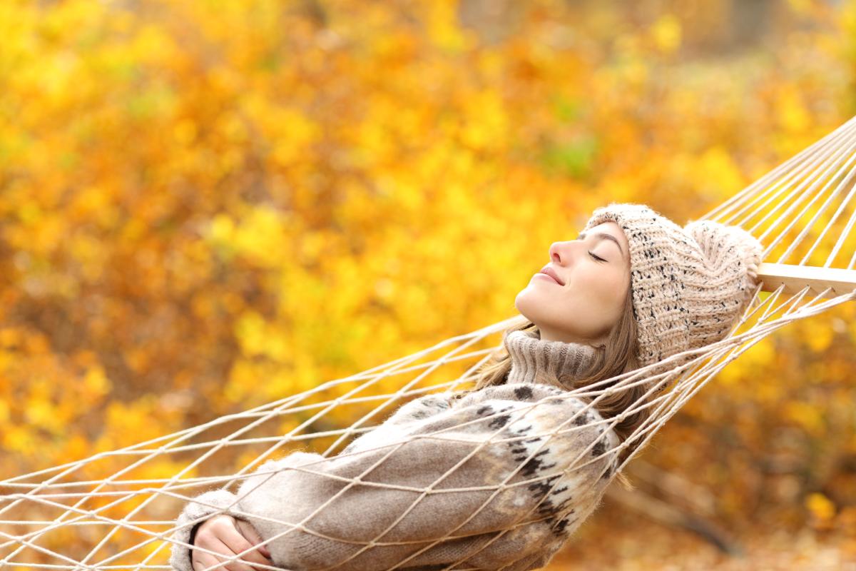 woman in hammock trying to manage here stress during the holidays