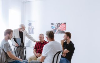 group of men enjoying benefits of a men's rehab program