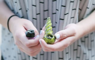 Man holding marijuana pipe aka "Bowl" - Drug Paraphernalia concept image