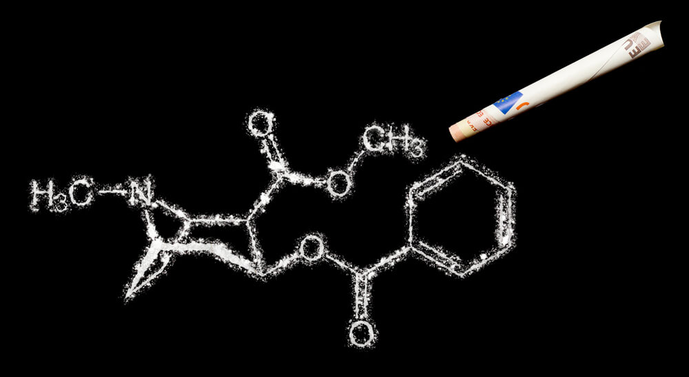 Cocaine molecular model made of powder cocaine lines - cocaine addiction treatment program concept image