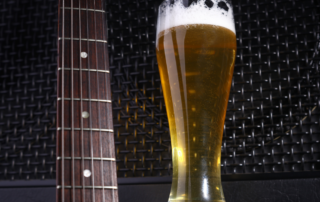 Guitar neck and pint of beer