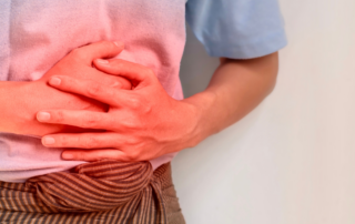 Man in pain holding his side